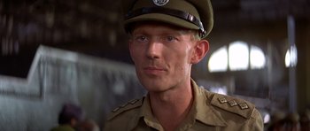 Movie still from “Gandhi” (1982), directed by Richard Attenborough – A person wearing a uniform; Close Up shot, Low angle