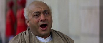 Movie still from “Gandhi” (1982), directed by Richard Attenborough – An older man with a surprised look on his face; Close Up shot, Low angle
