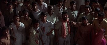 Movie still from “Gandhi” (1982), directed by Richard Attenborough – A group of men standing next to each other; Medium shot, High angle