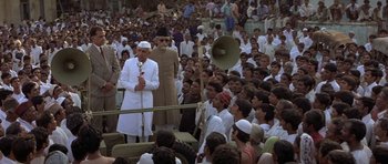 Movie still from “Gandhi” (1982), directed by Richard Attenborough – A crowd of people in white clothes and hats; Wide shot, High angle