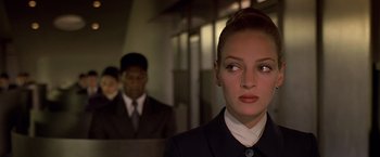 Movie still from “Gattaca” (1997), directed by Andrew Niccol – A woman in a suit and a man in a suit; Close Up shot, Over the shoulder angle