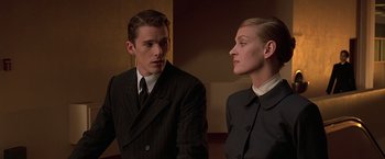 Movie still from “Gattaca” (1997), directed by Andrew Niccol – A man and a woman standing next to each other; Close Up shot, Low angle