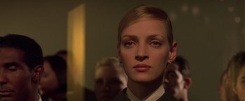 Movie still from “Gattaca” (1997), directed by Andrew Niccol – A woman's face in the dark; Close Up shot, Low angle