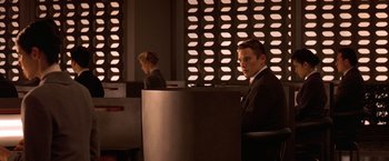 Movie still from “Gattaca” (1997), directed by Andrew Niccol – A man and a woman sitting at a computer desk; Medium shot, Over the shoulder angle