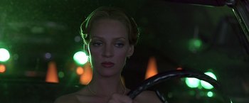 Movie still from “Gattaca” (1997), directed by Andrew Niccol – A woman holding a tennis racquet in her hands; Close Up shot, Low angle
