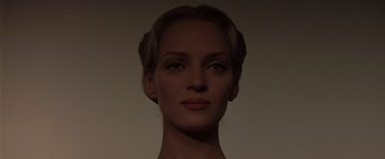 Movie still from “Gattaca” (1997), directed by Andrew Niccol – A beautiful woman with blonde hair wearing a black dress; Close Up shot, Low angle