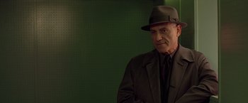 Movie still from “Gattaca” (1997), directed by Andrew Niccol – An older man wearing a hat and a suit; Close Up shot, Low angle