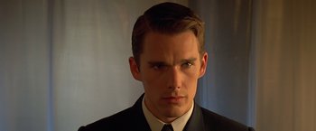 Movie still from “Gattaca” (1997), directed by Andrew Niccol – A person wearing a suit and tie; Close Up shot, Low angle