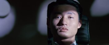 Movie still from “Gattaca” (1997), directed by Andrew Niccol – A man's face in the dark; Close Up shot, Low angle