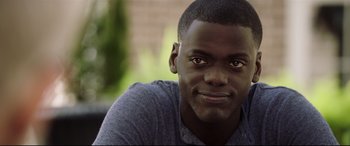 Movie still from “Get Out” (2017), directed by Jordan Peele – A young man's face; Close Up shot, Over the shoulder angle