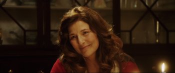 Movie still from “Get Out” (2017), directed by Jordan Peele – A person smiling for a picture; Close Up shot, Over the shoulder angle