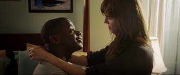 Movie still from “Get Out” (2017), directed by Jordan Peele – A man and a woman touching each other's face; Medium shot, Over the shoulder angle
