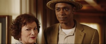 Movie still from “Get Out” (2017), directed by Jordan Peele – A man and a woman standing next to each other; Close Up shot, Over the shoulder angle