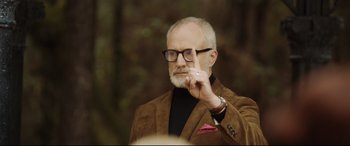 Movie still from “Get Out” (2017), directed by Jordan Peele – An older man in a brown jacket and glasses; Close Up shot, Over the shoulder angle