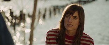 Movie still from “Get Out” (2017), directed by Jordan Peele – A person wearing a striped sweater; Close Up shot, Over the shoulder angle