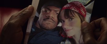 Movie still from “Get Out” (2017), directed by Jordan Peele – A man and a woman pose for a picture; Close Up shot, Overhead angle