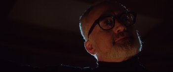 Movie still from “Get Out” (2017), directed by Jordan Peele – A person wearing glasses; Close Up shot, Low angle