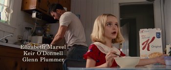 Movie still from “Gifted” (2017), directed by Marc Webb – A young girl sitting at a table with a bowl in her hand; Medium shot, High angle