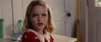 Movie still from “Gifted” (2017), directed by Marc Webb – A little girl with long blonde hair wearing a red dress; Close Up shot, Over the shoulder angle