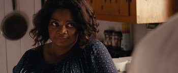 Movie still from “Gifted” (2017), directed by Marc Webb – An older woman sitting at a table in a kitchen; Close Up shot, Over the shoulder angle