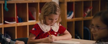 Movie still from “Gifted” (2017), directed by Marc Webb – A little girl is writing in a notebook; Close Up shot, High angle