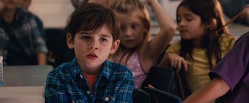 Movie still from “Gifted” (2017), directed by Marc Webb – A boy and a little girl sitting in front of each other; Close Up shot, Over the shoulder angle