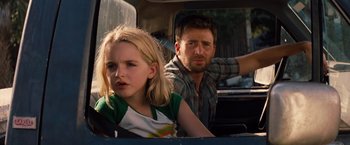 Movie still from “Gifted” (2017), directed by Marc Webb – A man and a little girl sitting in the back of a car; Close Up shot, Over the shoulder angle