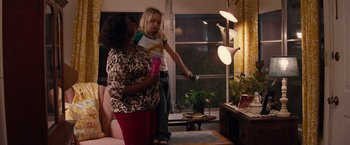 Movie still from “Gifted” (2017), directed by Marc Webb – Two women in a living room playing a video game; Medium shot, High angle