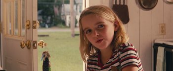 Movie still from “Gifted” (2017), directed by Marc Webb – A young girl with long blonde hair wearing a striped shirt; Close Up shot, Over the shoulder angle