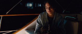 Movie still from “Gifted” (2017), directed by Marc Webb – A woman sitting on a bench at night; Medium shot, High angle