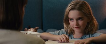 Movie still from “Gifted” (2017), directed by Marc Webb – A young girl sitting at a table and drawing; Close Up shot, Over the shoulder angle