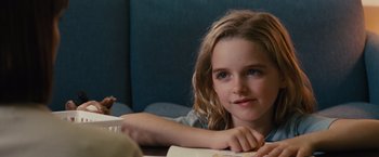 Movie still from “Gifted” (2017), directed by Marc Webb – A young girl sitting at a table writing; Close Up shot, Over the shoulder angle