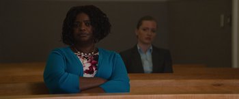 Movie still from “Gifted” (2017), directed by Marc Webb – Two women sitting in front of each other in a courtroom; Medium shot, Low angle