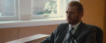 Movie still from “Gifted” (2017), directed by Marc Webb – A person wearing a suit and tie; Close Up shot, Over the shoulder angle