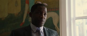 Movie still from “Gifted” (2017), directed by Marc Webb – A person wearing a suit; Close Up shot, Over the shoulder angle