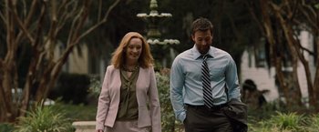 Movie still from “Gifted” (2017), directed by Marc Webb – A man and a woman walking in front of a fountain; Medium shot, Over the shoulder angle