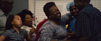 Movie still from “Gifted” (2017), directed by Marc Webb – A group of people that are laughing together; Medium shot, Low angle