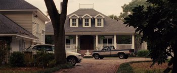 Movie still from “Gifted” (2017), directed by Marc Webb – Two trucks parked in front of a house; Extreme Wide shot, Low angle