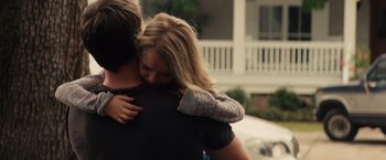Movie still from “Gifted” (2017), directed by Marc Webb – A man and a woman hugging in front of a house; Medium shot, Over the shoulder angle