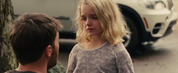 Movie still from “Gifted” (2017), directed by Marc Webb – A young girl in a floral shirt is talking to an older man; Close Up shot, Over the shoulder angle