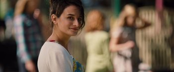 Movie still from “Gifted” (2017), directed by Marc Webb – A woman smiles while posing for a picture; Close Up shot, Over the shoulder angle