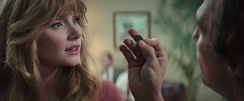 Movie still from “Gold” (2016), directed by Stephen Gaghan – A person holding something in their hand; Close Up shot, Over the shoulder angle