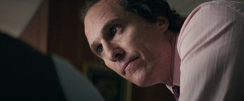 Movie still from “Gold” (2016), directed by Stephen Gaghan – A man's face looking upward; Close Up shot, Low angle