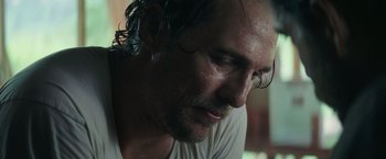 Movie still from “Gold” (2016), directed by Stephen Gaghan – A person with wet hair; Close Up shot, Low angle