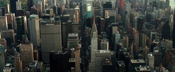 Movie still from “Gold” (2016), directed by Stephen Gaghan – An aerial view of a city with skyscrapers; Extreme Wide shot, High angle