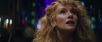 Movie still from “Gold” (2016), directed by Stephen Gaghan – A person with long blonde hair; Close Up shot, Low angle