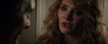 Movie still from “Gold” (2016), directed by Stephen Gaghan – A woman's eyes and mouth as she stares at the camera; Close Up shot, Over the shoulder angle