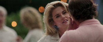 Movie still from “Gold” (2016), directed by Stephen Gaghan – A beautiful blond woman talking on a cell phone; Close Up shot, Over the shoulder angle