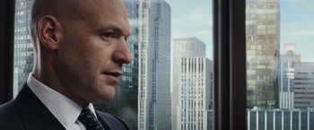 Movie still from “Gold” (2016), directed by Stephen Gaghan – A man looking out of a window; Close Up shot, Over the shoulder angle