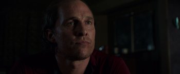 Movie still from “Gold” (2016), directed by Stephen Gaghan – A person looking at the camera; Close Up shot, Low angle